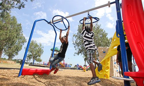 these are two children playing on a playground